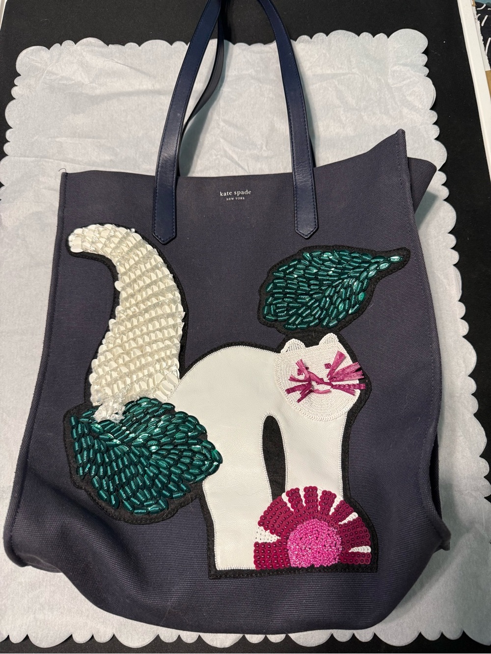 Kate Spade navy tote with colorful cat appliqué